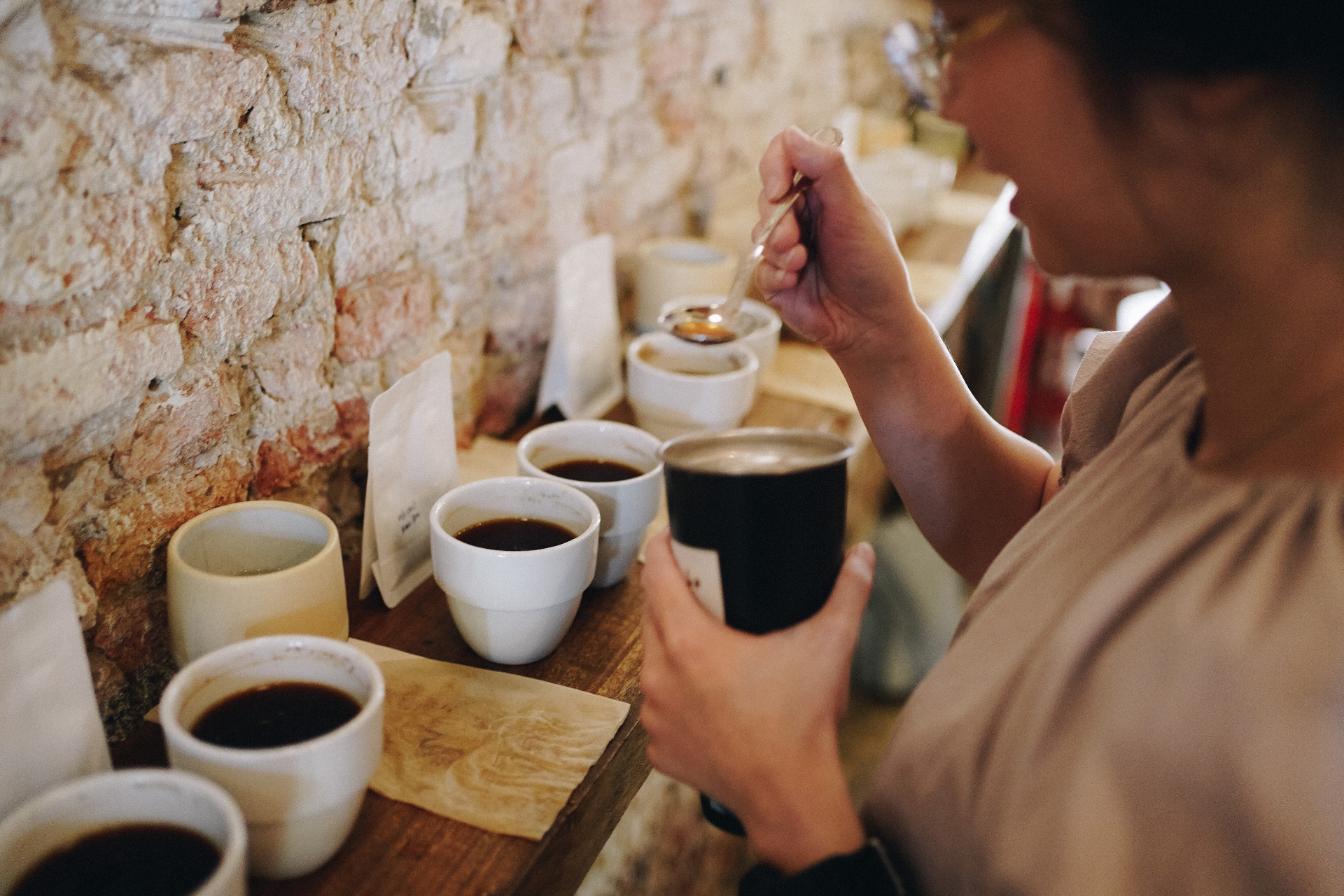 Coffee cupping session with tasting cups on the counter